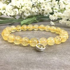 ✦Gemstone: Natural Citrine ✦Material: Sterling Silver CZ Charm ✦Color: Yellow ✦Shape: Round  ✦Length: 5''-9'' ✦Bead Size: 8mm  ✦QTY: 1 pcs / package ✦The 4mm and 6mm beads bracelet come with 6mm sterling sliver CZ charm.  ✦The 8mm and 10mm beads bracelet come with 8mm sterling silver CZ charm. ✦✦Please measure your wrist size, then order your bracelet. This bracelet makes the perfect gift for just about anyone in your friend or family circle. We have over 12 unique gemstone options to choose from. Please visit our store for more birthstones selection.  Citrine represents spiritual joy since it spreads positive, energetic light around its aura and is said to be one of only two crystals which do not need to be recharged or purified. Citrine can help facilitate prosperous occurrences all year Amber Crystal Bracelet With 8mm Beads As Gift, Citrine Gemstone Beads Bracelet As Gift, Citrine Gemstone Beads Crystal Bracelet As Gift, Citrine Crystal Bracelet Gift, Spiritual Citrine Crystal Bracelet With Gemstone Beads, Amber Crystal Healing Bracelet, Amber Crystal Bracelet With 8mm Round Beads, Healing Crystal Bracelet With Birthstone And Round Beads, Spiritual Beaded Birthstone Bracelets