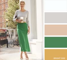 a woman in a green skirt holding a cup of coffee