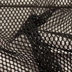 a black netted object is laying on the floor