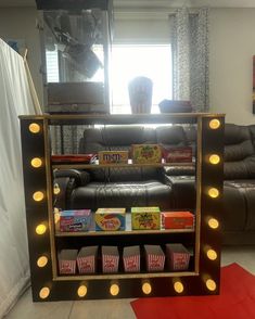 a living room filled with furniture and lots of lights on the side of it's shelf