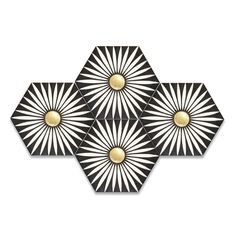 three black and white hexagonals with gold accents on them, one in the middle