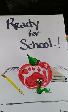 a sign that says ready for school with an apple and worm