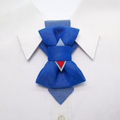 "Blue, aqua, and red are the traditional colors that represent the maritime style. A Hopper tie - Bow tie reminiscent of a vacation at the seaside or a fun party full of friends will be a wonderful addition to your everyday wear. Jeans, as well as block color, striped or checkered shirts will become the best companions for the Hopper tie \"Nice\". Simple and beautiful! Hand-made in Lithuania. Designed by - Rūta Piekurienė. Each item is packaged in a gorgeous box including an item passport and we Blue Standard Bow Tie For Father's Day, Blue Bow Tie For Father's Day, Dapper Blue Bow With Ties, Dapper Blue Bow Tie, Blue Tie With Bow Tie Back As A Gift, Blue Bow Tie As A Gift, Blue Dapper Bow Tie For Summer, Dapper Blue Bow Tie For Summer, Blue Bow Tie For Summer