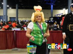 two people dressed up in costumes and one is holding a bucket with an egg on it