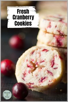 One cranberry cookie and a fresh cranberry leaning on a stack of the same cookies. Cranberry Shortbread Cookies, Fresh Cranberry Recipes, Cranberry Shortbread, Cranberry Cookies Recipes, Orange Shortbread, Cranberry Orange Shortbread Cookies, Icebox Cookies, Fresh Cranberry, Xmas Desserts