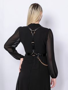 A harness designed to be timeless, the Chained Harness is handcrafted from real Italian leather.Adjustable at waist and shoulders, the piece beautifully frames the torso, creating a stylish and empowering look. With a detachable chain draping on the waist, you can style the harness over a dress, shirt or even a blazer. Waist belt width: 3 cm Adjustable using buckles at the waist and shoulders level Designed to be fitted on the waist Corset Harness, Harness Fashion, Body Harness, Wide Belt, Leather Chain, A Dress, Waist Belt, Full Grain Leather, Brown Gold