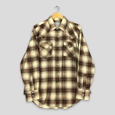 Vintage Channing Plaid Shadow Checkered Flannel Shirt Large Tartan Checked Grunge Hipster Shirt Indie Boho Flannel Western Buttondown Size L Good Used Condition. No Stains and No Holes Size (On Tag) : None but fit Size L **To make sure if it FITS YOU, refer at the exact measurements. Size Measurement (All measurements were taken lying flat) : Width [armpit to armpit] : 24 inches / 61 cm Length [shoulder to end of garment] : 31 inches / 79 cm THIS IS USED CLOTHING! PLEASE DON`T EXPECTED IT TO BE Boho Flannel, Grunge Flannel, Hipster Grunge, Hipster Shirts, Used Clothing, Western Wear, Flannel Shirt, Vintage Shirts, Vintage Tops