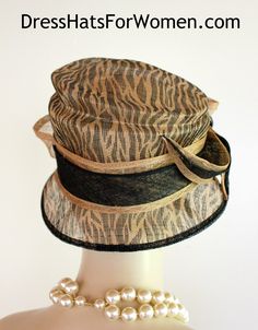 Ladies Black And Brown Beige Animal Print Sinamay Straw Designer Fashion Hat. This Dress Hat Is Suited For Weddings, Formals, Bridal, Mother Of The Bride, The Kentucky Derby And Horse Races.

Measurements: Crown Measures 22.5".  This lovely headpiece is suited for Spring, Summer or Early Fall.

All Sales Are Final. Fitted Cloche Hat For Summer Party, Summer Party Fitted Cloche Hat, Fitted Summer Party Cloche Hat, Black Top Hat For Summer Church Events, Black Top Hat For Church In Summer, Black Summer Top Hat For Church, Black Mini Hat For Formal Summer Events, Summer Evening Cloche Hat With Short Brim, Black Mini Hats For Formal Summer Events