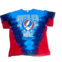 a blue and red tie - dye shirt with the grateful logo on it