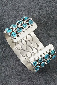 This stunning Kingman turquoise and sterling silver bracelet was made by Navajo silversmith Darlene Begay. The inside of the cuff is signed Darlene Begay and stamped sterling.Size: 5 3/4" (will fit up to a 6 3/4" wrist)Gap: 1"Width: 1 1/2"Free shipping on all orders! We ship with USPS and always include tracking. All orders ship within a day of payment.Returns are accepted up to 30 days after you receive your order. Just send us a message. Our shop offers cash back or store credit. The item must Southwestern Blue Cuff Bracelet Stamped 925, Southwestern Turquoise Cuff Bracelet Stamped 925, Turquoise Sterling Silver Cuff Bracelet With Inlay, Turquoise Southwestern Cuff Bracelet Stamped 925, Sterling Silver Turquoise Cuff Bracelet With Inlay, Southwestern Turquoise Sterling Silver Cuff Bracelet, Kingman Turquoise, Sterling Silver Bracelet, Native American Jewelry