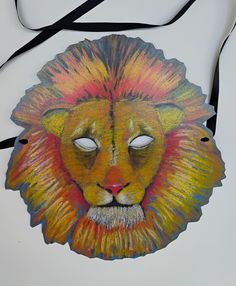 a drawing of a lion's face on a white background with a black strap