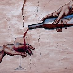 two hands reaching for a wine glass in front of a painting on the side of a wall