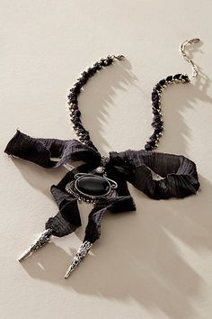 Add a head-turning touch to absolutely any look with this stand-out necklace featured in a textile-adorned chain design with defined pendant at center and exaggerated bow detail for an effortlessly edgy finishing touch. | Boca Bow Layer Necklace by Free People in Black Adjustable Necklace With Decorative Bow, Bow Choker Jewelry For Parties, Black Ribbon Necklace For Party, Chic Party Jewelry With Ribbon Detail, Chic Evening Jewelry With Decorative Bow, Chic Party Jewelry With Ribbon, Black Bow Jewelry For Evening, Elegant Black Necklace With Bow, Chic Adjustable Jewelry With Bow Detail