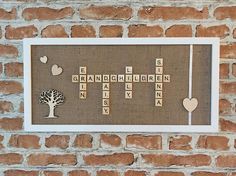 a scrabbled crossword puzzle on a brick wall with trees and hearts