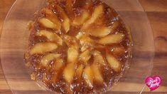 an upside down apple pie on a clear plate