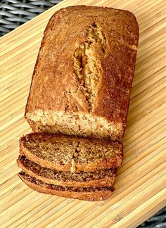 a loaf of bread sitting on top of a wooden cutting board