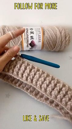 two skeins of yarn are being used to make crochet knitting needles