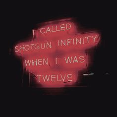 a red neon sign that says i called shotgun infinity when i was twelve