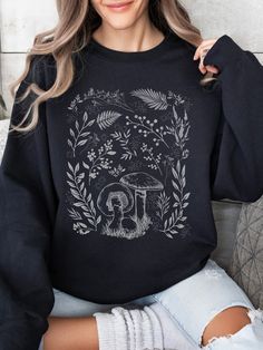 FREE SHIPPING!   PRODUCT DETAILS: *Ideal for any situation, this unisex crewneck sweatshirt offers pure comfort. *Made from medium-heavy fabric (8.0 oz/yd² or 271.25 g/m²). *Unisex, Loose fit.  *Composed of 50% Cotton for softness and 50% Polyester to resist stretching and shrinking. *No itchy side seams. *The ribbed knit collar with seam helps retain its shape. CARE INSTRUCTIONS: Machine wash cold (max 30oC or 90oF) on a delicate cycle. Use non-chlorine bleach as needed. Tumble dry on low heat. Fall Crew Neck T-shirt With Plants Print, Casual Crew Neck Sweatshirt With Mushroom Print, Cotton Crew Neck Sweatshirt With Mushroom Print, Relaxed Fit Fall Tops With Mushroom Print, Botanical Relaxed Fit Tops For Fall, Relaxed Fit Mushroom Print Top For Fall, Relaxed Fit Top With Mushroom Print For Fall, Fall Mushroom Print Crew Neck Sweatshirt, Fall Cotton Sweatshirt With Plant Print