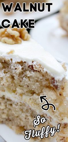 there is a piece of cake with white frosting and walnuts on the top