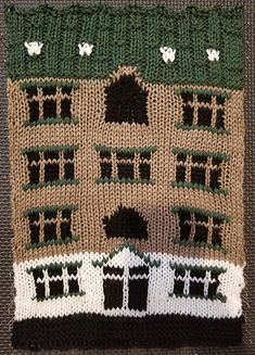 a close up of a knitted house