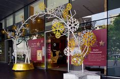 the entrance to an art gallery with snowflakes on display