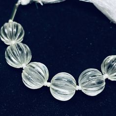 This listing is for 100% Natural Crystal Quartz Carved Melon Shape Beads Strand, Melon Shape Gemstone, Gemstone for Jewlery, 12 mm.   100% Natural Crystal Quartz Carved Melon Shape Beads Strand, Melon Shape Gemstone, Gemstone for Jewlery, 12 mm.  Size: 12 mm  (Measurement are close to approximations.) Product:  Beads Strand  Type Of stone-:  Crystal Quartz Shape: Melon Style: Carved 100% Genuine & Natural Important Information : * Express Shipping available for extra charge. * Free Custom Drilli Elegant Round Spacer Beads, Clear Faceted Round Beads Bracelet, Clear Faceted Round Beaded Bracelets, Handmade Clear Beaded Round Bracelets, Silver Gemstone Round Beads, Silver Gemstone Beads And Cabochons, Polished Round Beads For Jewelry Making, Round Polished Beads For Jewelry Making, Elegant 8mm Round Beads For Gems And Cabochons