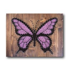 the butterfly is made out of yarn and beads