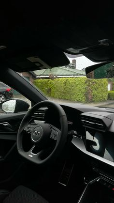 the interior of a car with dashboard and steering wheel