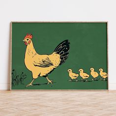 a chicken and her chicks are walking on the floor in front of a green wall