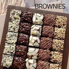 a box filled with lots of different types of chocolates and nuts on top of each other