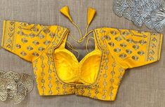 Stunning yellow heavy embroidery choli cut saree blouse. Buy designer blouse in USA from Pure Elegance. Disclaimer: The actual product may vary slightly from the image. These are custom orders, hence expect slight variation in color, placement of the motif or buta. ESTIMATED DELIVERYBecause this is a custom order, it would take about 4 weeks from the date of purchase. RETURN POLICY: This product is a custom order and cannot be returned or exchanged. Yellow Blouse For Reception And Festivals, Yellow Resham Embroidery Blouse For Navratri, Yellow Blouse With Resham Embroidery For Navratri, Yellow Blouse With Resham Embroidery For Reception, Fitted Yellow Choli With Resham Embroidery, Fitted Yellow Blouse For Reception, Yellow Resham Embroidery Blouse Piece For Diwali, Yellow Resham Embroidery Blouse Piece For Festive Occasions, Yellow Resham Embroidery Blouse Piece For Festive