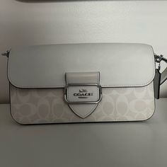 White Shoulder Bag And Matching Wallet From Coach. Only Used Twice. In Almost New Condition. Beautiful Bag In Style! Comes With Extra Strap So It Can Be Worn As A Crossbody. Designer White Flap Bag With Detachable Strap, Designer White Flap Bag For Formal Occasions, Luxury White Flap Bag With Removable Pouch, White Luxury Flap Bag With Magnetic Closure, Luxury White Flap Bag With Magnetic Closure, Formal White Flap Bag With Detachable Strap, Designer White Shoulder Bag With Magnetic Closure, Classic White Flap Shoulder Bag, Designer White Rectangular Flap Bag