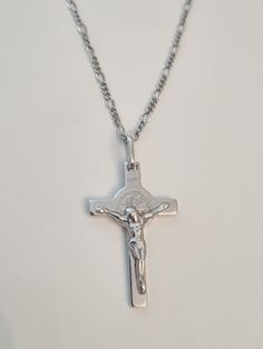 This Spiritual Crucifix of Saint Benedict Double Sided made from high quality sterling silver 925 its the perfect gift for anyone and excellent for everyday wear. Crucifix size :3.5cm (with a hook) ×1.8cm Chain length : 45 cm or 50cm Silver Necklaces Cross, Silver Crucifix Necklace, Classic Silver Crucifix Necklace, Classic Sterling Silver Crucifix Necklace, Hallmarked White Gold Crucifix Necklace, Classic Silver Crucifix Jewelry, Sterling Silver Crucifix Necklace With Polished Finish, Stamped 925 Crucifix Necklace For Gift, Sterling Silver Crucifix Necklace With Silver Chain