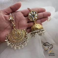 Gold plated, pure thapa kundan set. Jhumkis are very lightweight, tikka is handcrafted. Jhumkis length 2.7 inches approx. Gold Kundan Jhumkas For Festivals, Gold Kundan Jhumkas For Diwali, Wedding Brass Jhumkas With Tilla Detail, Wedding Brass Chandbalis With Tilla Detailing, Wedding Brass Chandbalis With Tilla, Wedding Chandbalis In Brass With Tilla Detail, Wedding Chandbalis With Tilla In Brass, Gold Plated Chandbali Tikka For Festivals, Traditional Gold Plated Chandbali Tikka