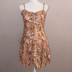 Nwt Wild Fable Floral Sundress In A Floral Pattern With Rust, Pink And Tan Flowers On A White Background. Sundress With Adjustable Spaghetti Straps And Sweetheart Neckline With Small Ruffle Detail And Tie-Up Bow At Center Of Bust. Fitted Flattering Chest With Darting, Gathered Smocked Stretch Back For Comfy Fit. Dress Goes Into A-Line Shape With Cute Contrasting Pleats Sewn Into Skirt For Movement, Hits Above Knee At About Mid Thigh. New With Tags, Size Medium, Retail $30. Tan Flowers, Stretch Back, Floral Sundress, Fit Dress, Wild Fable, Comfy Fits, Above Knee, Sweetheart Neckline, Sundress