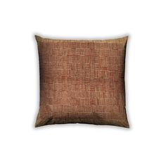 an orange and brown pillow on a white background