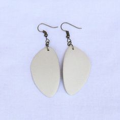 Elevate your accessory game with our exquisite handmade ceramic earrings. These unique clay earrings are perfect for anyone looking to treat yourself, or looking for a great gift. The geometric minimalist design makes these earrings a stunning match for any outfit. Lightweight feel and stylish, these earrings are a must-have addition to your jewelry collection. Small Batch: We make these earrings in batches of roughly 25 at a time, per color, per shape. Handmade: These earrings are made of real fired ceramic, by our hands, every week. Please keep in mind this means each individual earring will have very slight variations in size, shape and color. We think this is part of the charm and character each pair has, and imagine you do as well. Hypoallergenic: The earring hardware that we use is a Unique Clay Earrings, Ceramic Earrings, Ceramic Earring, Earrings Minimalist, Small Batch, Minimalist Earrings, Handmade Ceramic, Small Designs, Clay Earrings