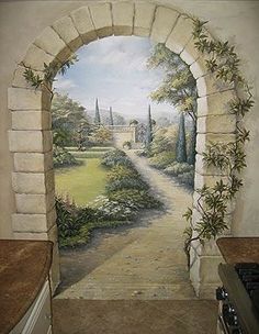 a painting on the wall of a kitchen with an arched doorway leading to a garden