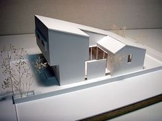 an architectural model of a house on display