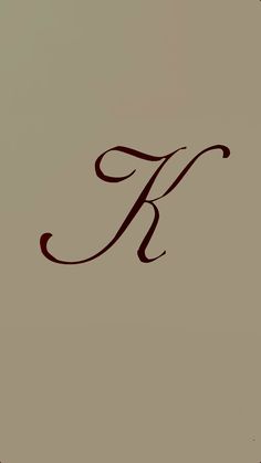 the letter k is inscribed in cursive writing