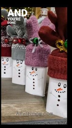 several snowmen are wrapped in white paper bags