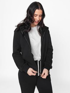 Classics are classic for a reason, and our Classic Zip Hoodie lives up to its name. The Classic Zip Hoodie combines lightweight softness + our beloved full-zip style to create the ultimate comfy basic. Pair it with the Classic Sweatpant for maximum comfort + style! Color: Black Full zipper Hood Functional front pockets Rollable + cinched wrist cuffs Ribbed cuffs + bottom hem Signature “Little Bipsy” side tag Material + Wash: 86.7% cotton | 13.3% polyester Machine wash gentle with like colors Dry Black Hooded Jacket With Ribbed Cuffs For Loungewear, Black Outerwear With Kangaroo Pocket For Loungewear, Black Hooded Jacket For Winter Loungewear, Fleece Hooded Jacket With Drawstring Hood For Everyday Use, Everyday Fleece Hooded Jacket With Drawstring, Basic Everyday Hooded Hoodie, Relaxed Fit Zipper Hoodie For Winter, Everyday Hooded Jacket With Double-lined Hood, Basic Fleece Outerwear For Fall