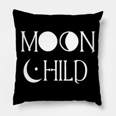 a black pillow with the words moon child printed on it, and an image of a crescent