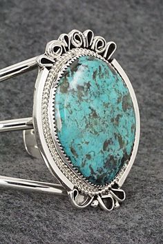 This stunning turquoise and sterling silver bracelet was made by Navajo silversmith Leslie Nez. The back is signed Leslie Nez and Sterling.Size: 5 1/2" (will fit up to a 6 5/8" wrist)Gap: 1 1/8"Length: 2 1/4"Width: 1 3/4"Free shipping on all orders! We ship with USPS and always include tracking. All orders ship within a day of payment.Returns are accepted up to 30 days after you receive your order. Just send us a message. Our shop offers cash back or store credit. The item must be returned in ne Sterling Silver Bracelet, Native American Jewelry, Turquoise Sterling Silver, Free Jewelry, Sterling Silver Bracelets, Silver Bracelet, Gap, Turquoise, Bracelet