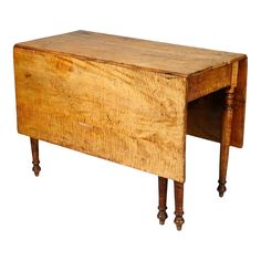 an old wooden desk with two legs and a drawer on one end, against a white background