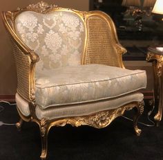 an ornate chair and table in a room