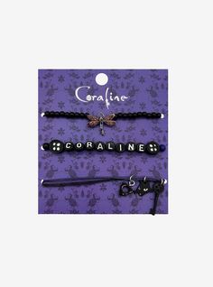 three different bracelets with black beads and charms on purple floral print background, one is for coralline