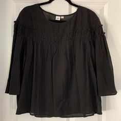 Black Cotton Gauze Flowy Top With Ruffled Detail And 3/4 Sleeves. Never Worn Perfect Condition Casual Black Half Sleeve Blouse, Black Long Sleeve Tops For Daywear, Long Sleeve Black Tops For Daywear, Black Gap Top For Summer, Gap Black Summer Top, Spring Black Tops By Gap, Black Cotton Half Sleeve Blouse, Black Half Sleeve Cotton Blouse, Black Relaxed Fit Blouse With 3/4 Sleeve