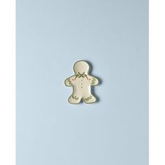 a cookie shaped like a teddy bear on a blue background